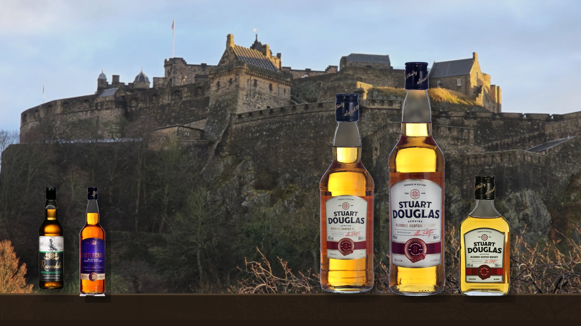 Stuart Douglas, Castlecraig and Ravendale bottles in front of Edinburgh Castle